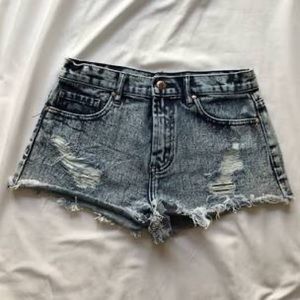 Cute denim shorts with rose gold medal.